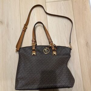 Genuine Leather Michael Kors tote bag with gold hardware and crossbody strap
